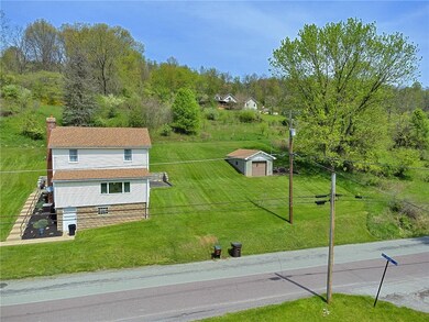 View of front of home with garage to right.