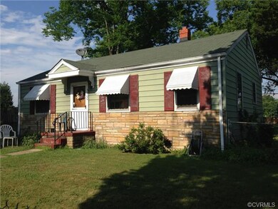 Exterior Front. Stone with Aluminum Siding. Roof w