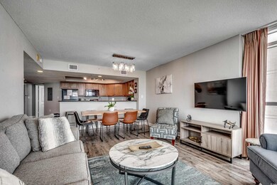 Living room with light hardwood / wood-style floor