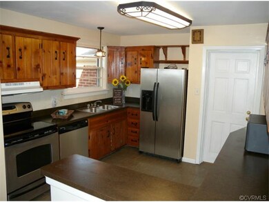 The pretty Kitchen has stainless appliances, a cer