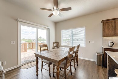 Informal dining area with deck off to the left. Great view to the East overlooking nice yard.
