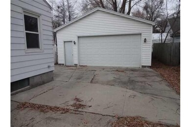 Exterior Front. 2 1/2 car garage with wood burner
