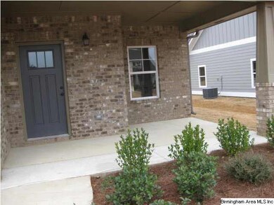 Professional landscaping, welcoming front porch, a