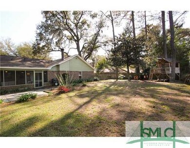 Exterior Back. Fenced back yard with patio and pla