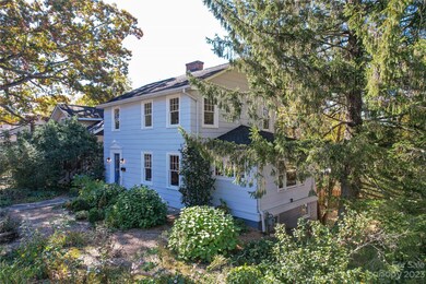 Mature Trees and Shrubs Frame the Home
