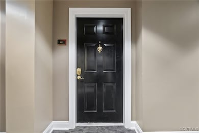 Front door to Unit 309 on the 3rd floor of Fall Li