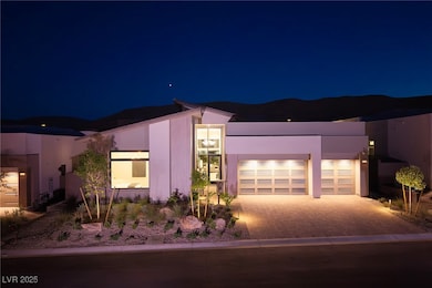 View of front of home with driveway, an attached g
