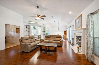 VIEW OF LIVING RM ACCENTED WITH FIREPL