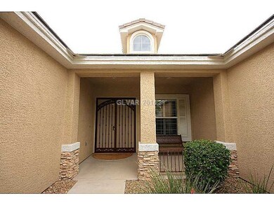 Facade/Exterior Front. Stone covered columns lead