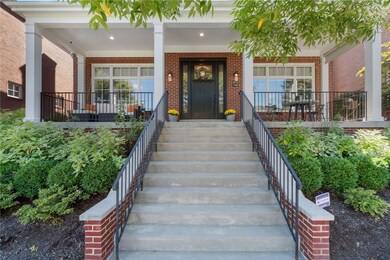 A full, covered front porch greets you.