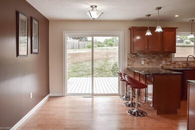 Dinette with a sliding door to the back deck.