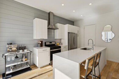 Kitchen with stainless steel appliances, wall chim