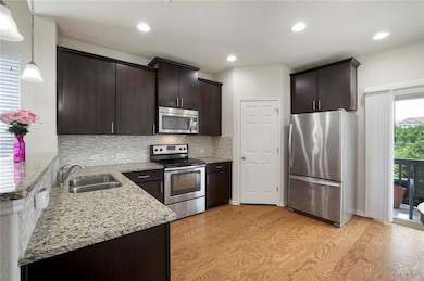 Kitchen featuring appliances with stainless steel