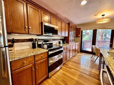 Kitchen featuring stainless steel appliances, ligh