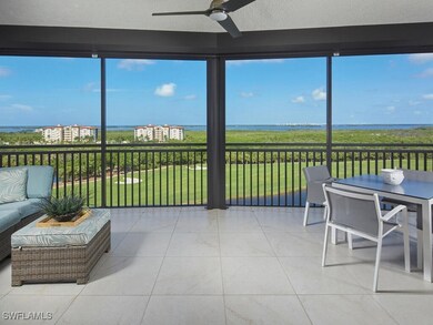 Sunroom with a water view and ceiling fan