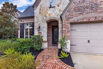 Exterior upgrades with brick and stone elevation. Notice the custom front door.