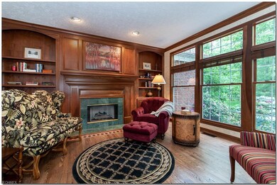Retire to the library with flanking book cases on 