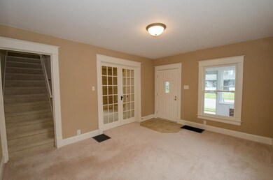 Living room with beautiful french doors leading in