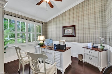Office area with vaulted ceiling, crown molding, a
