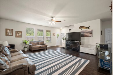Large family room with high ceilings and LTV floor