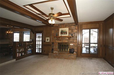 You step down into the welcoming family room, whic