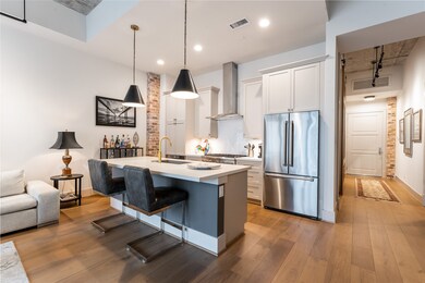 The kitchen island provides storage with a breakfa