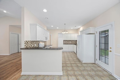 Kitchen featuring a healthy amount of sunlight, wh