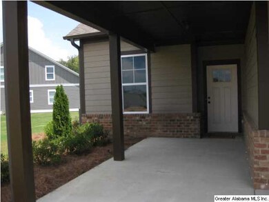 Huge covered front porch welcomes guest out of the