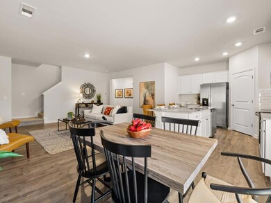 sudbury townhome kitchen with white cabinets and g
