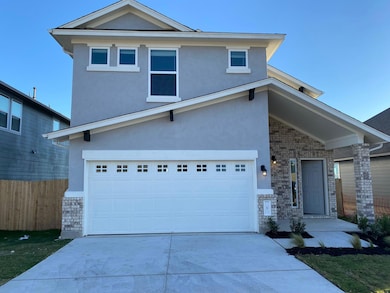Traditional home with stucco siding, concrete dri