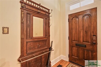 Welcoming foyer w/transom & attached, space-saving