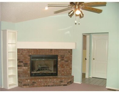 wood burning fireplace in upstairs livingroom