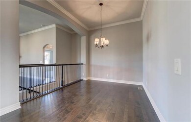 Formal dining room with arches and designer lighti