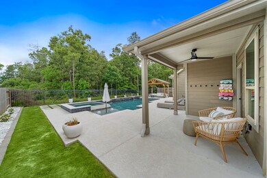 The backyard also features a covered patio and bac