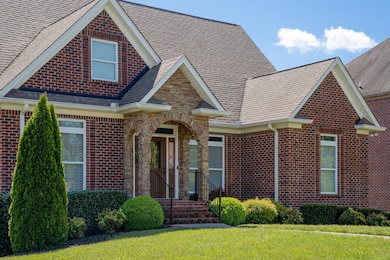 Beautiful all brick with stone accents and clean landscaping. Custom 3-car garage 4 Bed/4.5 Bath. Huge Basement home w surround sound located in coveted Somerset Downs! Saferoom perfect for tornado shelter/gun safe. 