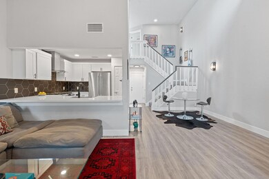 Living area featuring light wood-type flooring, v