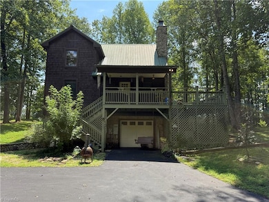 Garage with covered porch above