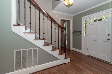 Foyer with hardwood stairs