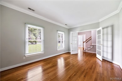 Living Room has french doors, hardwood floors and