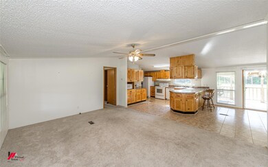 Kitchen with a center island, a breakfast bar area
