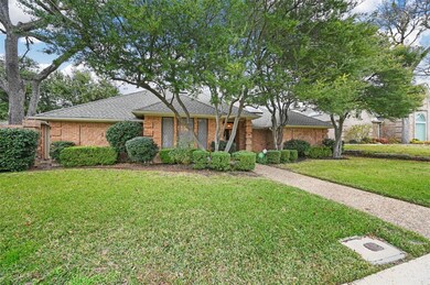 Ranch-style house with a front lawn