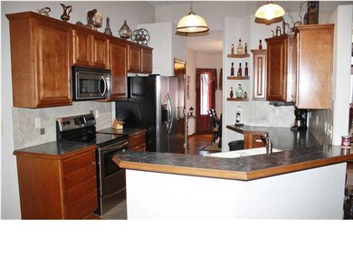 Kitchen features Stainless Steel appliances, tall 