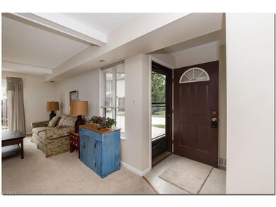 Foyer area opens to a light filled living room