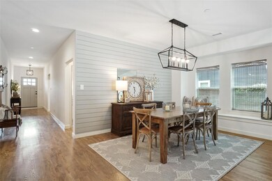 Dining area featuring hardwood / wood-style floors and a chandelier
