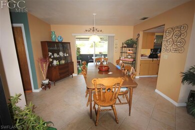 Dining room leading to kitchen and rear screened l