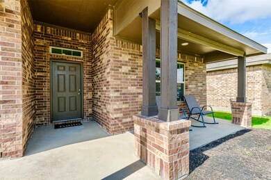 Covered front patio for relaxing evenings, with community views