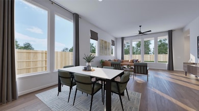 Dining space featuring ceiling fan, wood finished
