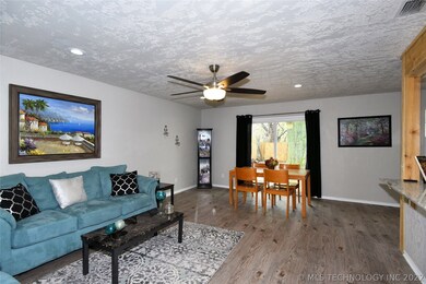 Living room is open to kitchen and back yard.