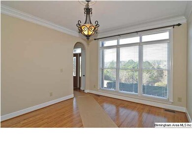 Formal dining room has plenty of space, hardwood f
