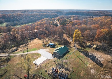 View from above of property featuring a forest